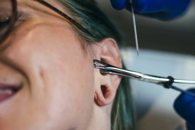 consecuncias piercing boca